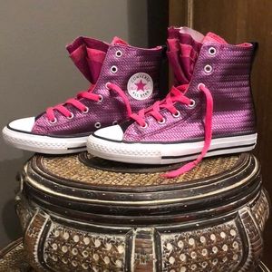 Girls Converse high tops.